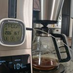 A digital thermometer is attached to the coffeemaker. It shows a temperature of 167 degrees.